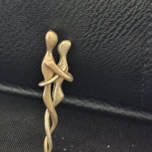 Artisan Man And Woman In Embrace Pendant